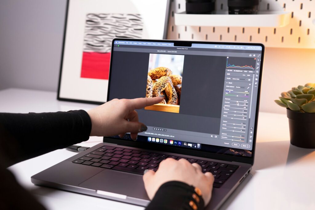 A person sitting in front of a laptop computer